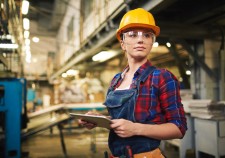 Young factory worker controlling the work