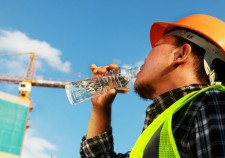Constuction worker drinking water on a location site