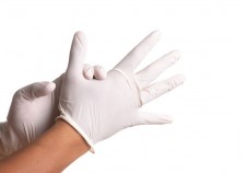 Doctor hand in white latex sterile gloves isolated on white background