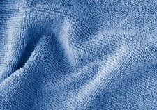 Wrinkled blue microfiber cloth texture of microfiber towel colored in trendy color of year 2020 Classic blue closeup